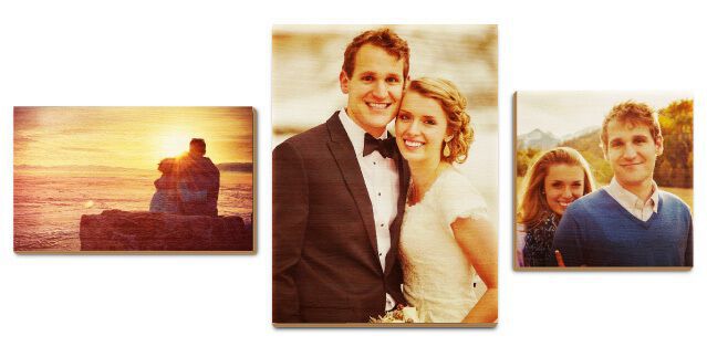 Three wooden prints of a couple on wall